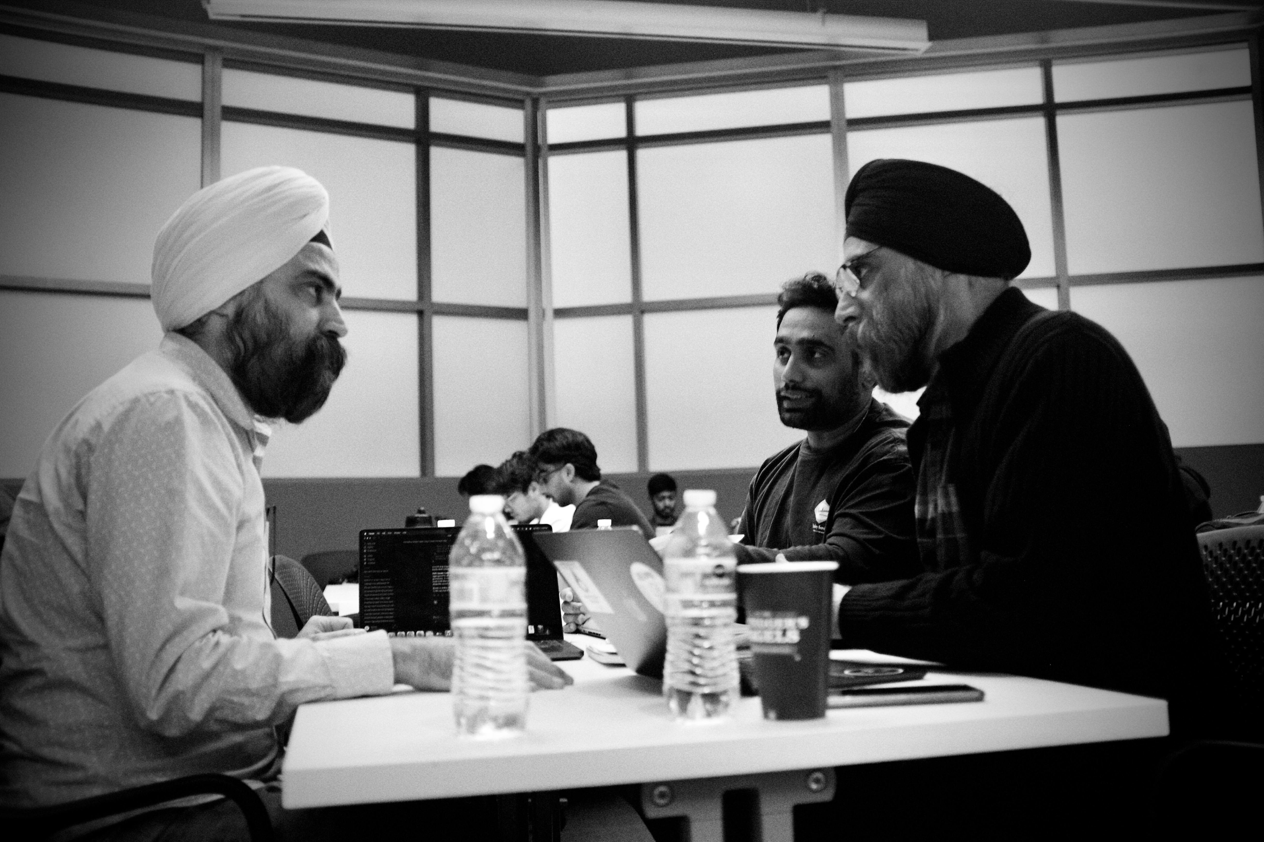 Participants discussing a project together at the San Diego Impact Lab